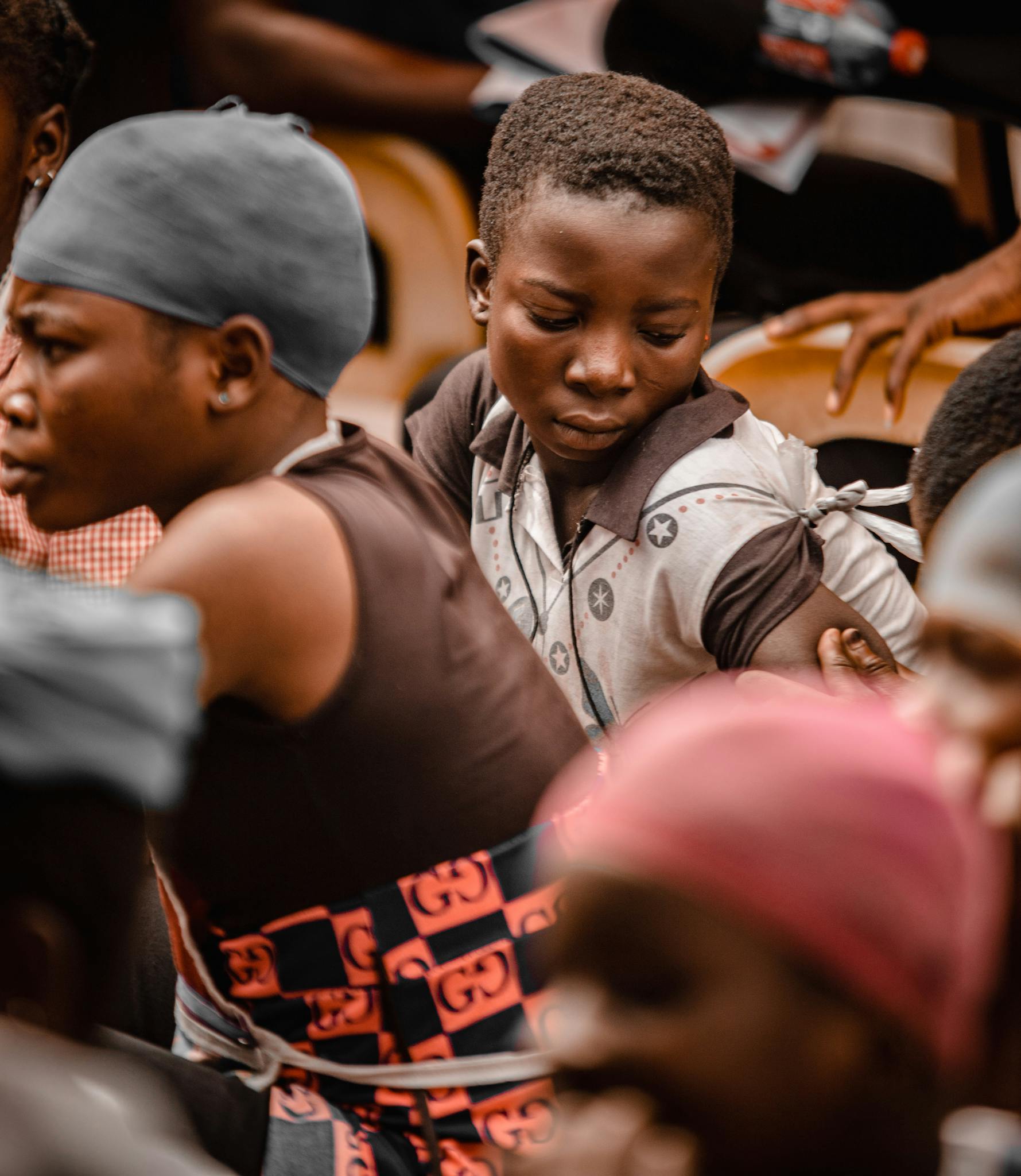 A candid moment capturing children focused on their activity outdoors in Accra, Ghana.